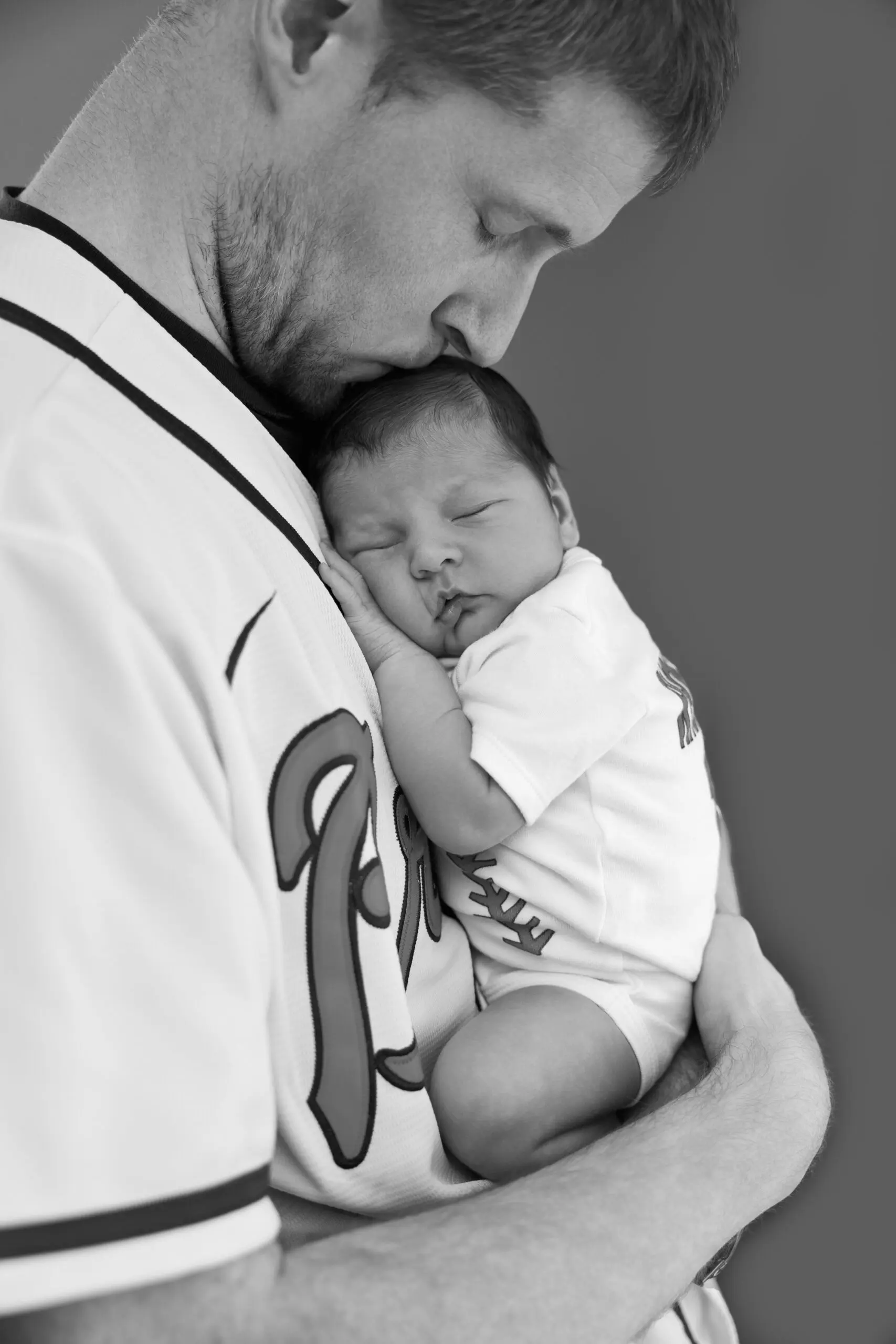 Baseball dad and baby newborn photo
